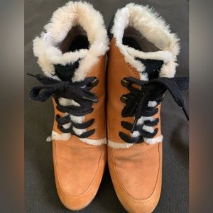 Stylish winter boots. Waterproof leather upper and faux shearling for lining.